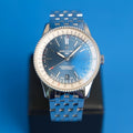 Breitling Navitimer Automatic 38 Frontansicht des blauen Zifferblatts mit Rechenschieber-Lünette